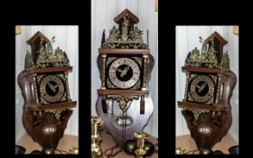 A Dutch Reproduction Friesland Style Brass Bracket Wall Clock on weight.