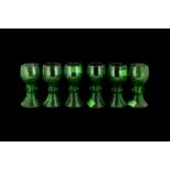 A Set of Six German Green Coloured Hock Glasses with applied lion masks to the stem on a ribbed