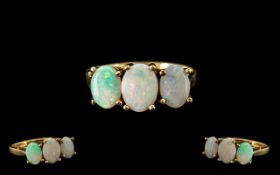 Ladies 9ct Gold Attractive 3 Stone Opal Set Dress Ring. Fully hallmarked for 9.375. Ring size Q.