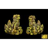 Pair of Antique Chinese Temple Dogs with a brown and yellow speckled glaze,