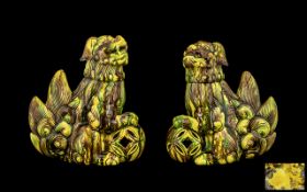 Pair of Antique Chinese Temple Dogs with a brown and yellow speckled glaze,