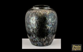 Poole Early Period Large Ovoid Shaped Lustre Vase mottled blue on black ground.