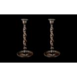 Pair of Oak Barleytwist Candlesticks with brass sconces, c1930s; 12 inches (30cms) high.