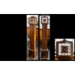 Art Deco Walnut Cased Grandmother Clock with a typical square chrome dial,