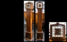 Art Deco Walnut Cased Grandmother Clock with a typical square chrome dial,