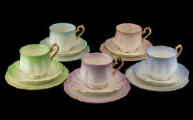 Royal Albert 'Rainbow' Bone China Trios, five in total, comprising a cup, saucer and side plate,