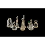 A Collection of Eight Cut Glass Mostly Scent Bottles some with silver collars A/F. The tallest