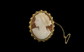 A Shell Cameo Set in 9ct Gold Mount with rope twist border, fully hallmarked.