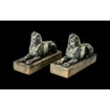 Pair of Antique Bronze Regency Period Egyptian Sphinx on white marble bases,