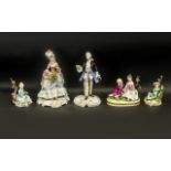 Five Porcelain Capo di Monte Figures comprising an elegant pair, man and woman,