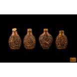 Four Chinese Carved Boxwood Snuff Bottles, with stoppers; late 20th century. Signed To Base.