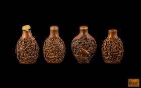 Four Chinese Carved Boxwood Snuff Bottles, with stoppers; late 20th century. Signed To Base.