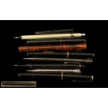 A Collection of Early 20th Century Fountain Pens, comprising: 1.