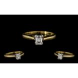 Contemporary Designed 18ct Gold Single Stone Diamond Ring of top quality. The emerald cut diamond of