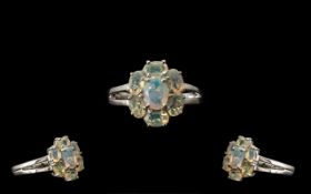 Opal Seven Stone Cluster Ring, an oval c