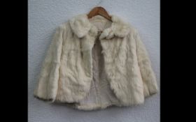 Ladies Cream Fur Jacket. Fastens at top