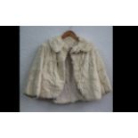 Ladies Cream Fur Jacket. Fastens at top