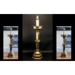 A Gothic Antique Brass Converted Candlestick Lamp of typical form, Measures 30 inches hight.