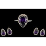 Ladies Amethyst Ring Set in a Silver Shank, with matching earrings.