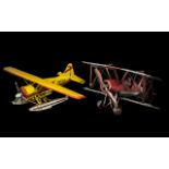 Two Tin Painted Model Aeroplanes measuring 14 and 11 inches.