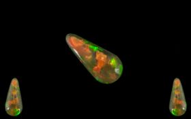 Ethiopian Natural Orange Tear Drop Fire Opal. 2.27 cts. Measurements 19.5 x 9 x 3.4 mm.