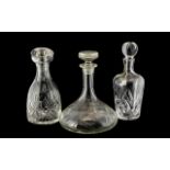Collection of Three Large Decanters, comprising a Waterford Crystal 'Marquis' decanter,