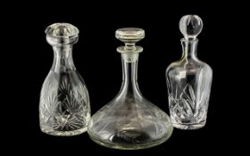 Collection of Three Large Decanters, comprising a Waterford Crystal 'Marquis' decanter,