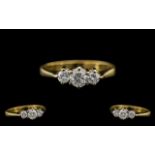 18ct Gold and Platinum - Attractive 3 Stone Diamond Set Dress Ring.