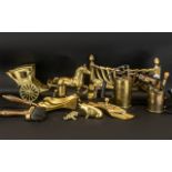 A Collection of Brassware comprising a horse and cart, two blow torches, a fireguard,