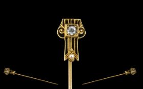 14ct Gold Stick Pin Circa 1910-1930 set with gemstone and seed pearl. 1.6 grams.