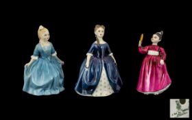 Three Royal Doulton Figures, comprising 'A Child From Williamsburg' 6'' tall in a pale blue