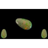 Ethiopian Natural Pear Shaped Green / Orange Opal. 3.07 cts. Measurements 20.1 x 12.2 x 3.3 mm.
