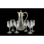 Drinker's Interest - A Large Cut Glass Lidded Wine Jug with plated lid and handle,