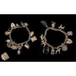 A Pair of 1970's Sterling Silver Charm Bracelets, Loaded with ( 23 ) Sterling Silver Charms,