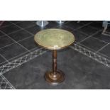 A Brass Topped Side Table fitted on a Beechwood turned base. Measures 18 by 24 inches.
