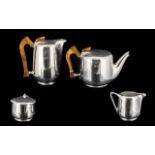 Four Piece Alloy Tea Set with wooden handles, by Newman, England,