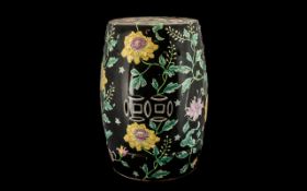 Oriental Pottery Garden Stool with famille noir decorations;