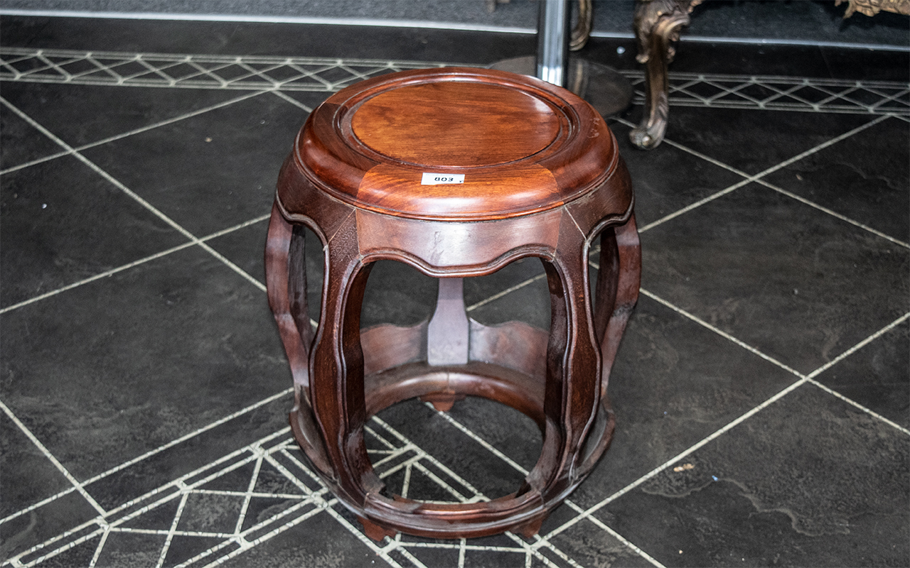 Chinese Rosewood Barrel Shaped Stool with five encased, bowed legs,