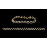 Ladies - Attractive 10ct Gold Baguette Diamond Set Tennis Bracelet of Contemporary Design.