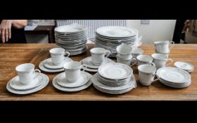 Large Dinner/Tea Service in Fine Porcelain, in white ground with delicate floral trim,