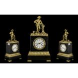 A French Gilt Brass Figural Clock with white enamel dial and Roman Numerals,
