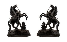 A Pair of Antique Spelter Marley Horses of black bronzed Patination on wood bases. Measuring 18