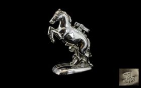 1930s Chromed Metal Petrol Cigarette Lighter in the shape of a rearing horse, with a Bell Trade Mark