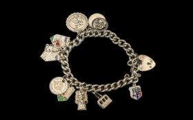 Solid Silver Charm Bracelet, complete with charms, comprising: Isle of Man Logo, cable car,