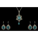 Ladies Blue Topaz & Marcasite Silver Pendant on silver chain, with matching earrings.