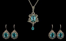 Ladies Blue Topaz & Marcasite Silver Pendant on silver chain, with matching earrings.