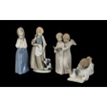 Collection of Four Nao Figures comprising: a figure of two angels with a hymn book,