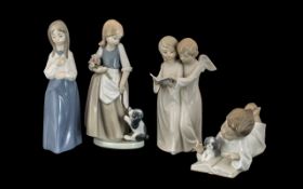 Collection of Four Nao Figures comprising: a figure of two angels with a hymn book,