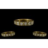 18ct Yellow Gold - Attractive 7 Stone Diamond Ring of Contemporary Design.