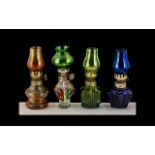 A Set Of Four Miniature Oil Lamps - Various Colours, Please See Acompanying Image.
